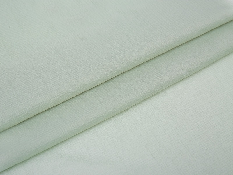How does Polyester Interlining improve the comfort of clothing through breathability?